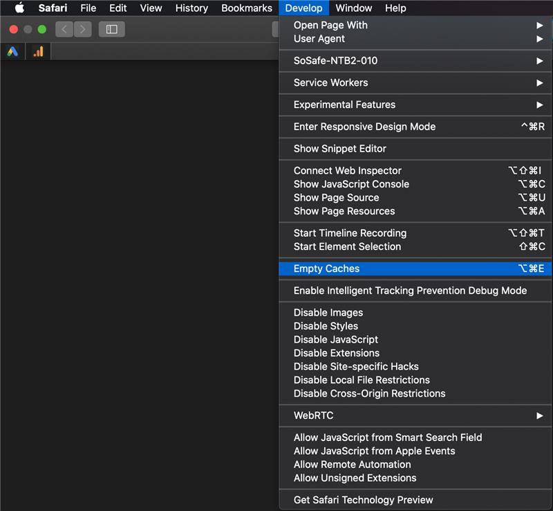 Safari Develop menu open with Empty Caches highlighted in blue, listed above Enable Intelligent Tracking Prevention Debug Mode.