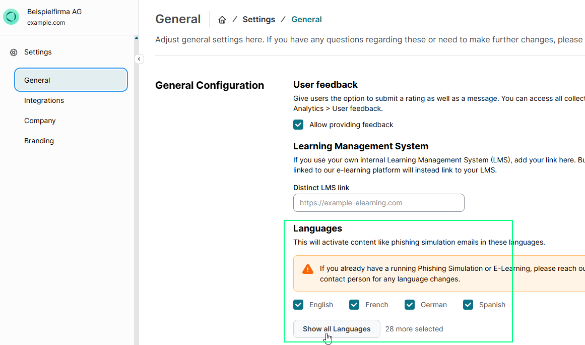 SoSafe Manager General settings page with the Languages section highlighted, showing English, French, German, and Spanish enabled, a warning about contacting SoSafe for language changes on running campaigns, and the Show all Languages button with 28 more selected.